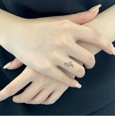 A word or phrase tattooed on your finger can have a powerful and personal meaning.